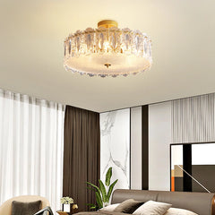 Modern ceiling light fixture in a living room setting with a sofa and decorative elements.