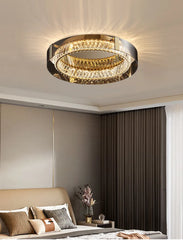 Modern ceiling light fixture in a bedroom setting with neutral colors