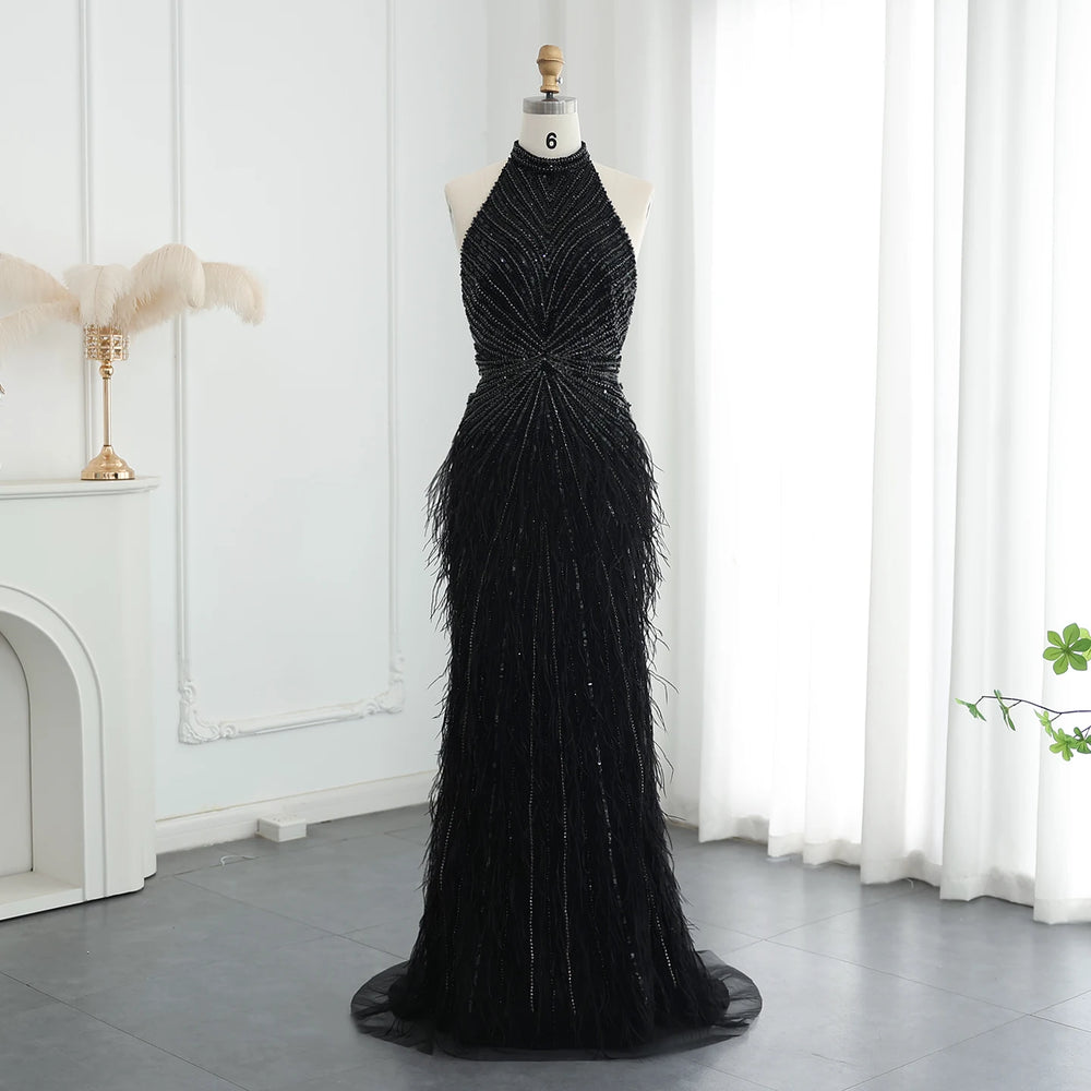 Black beaded evening gown on a mannequin against a white curtain background