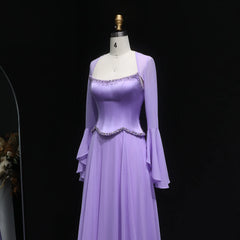 Purple evening gown on a mannequin against a black background