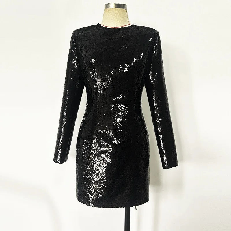 Black sequin dress on a mannequin against a white background