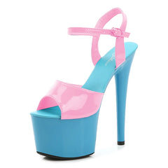 Blue and pink high-heeled platform shoe on a white background