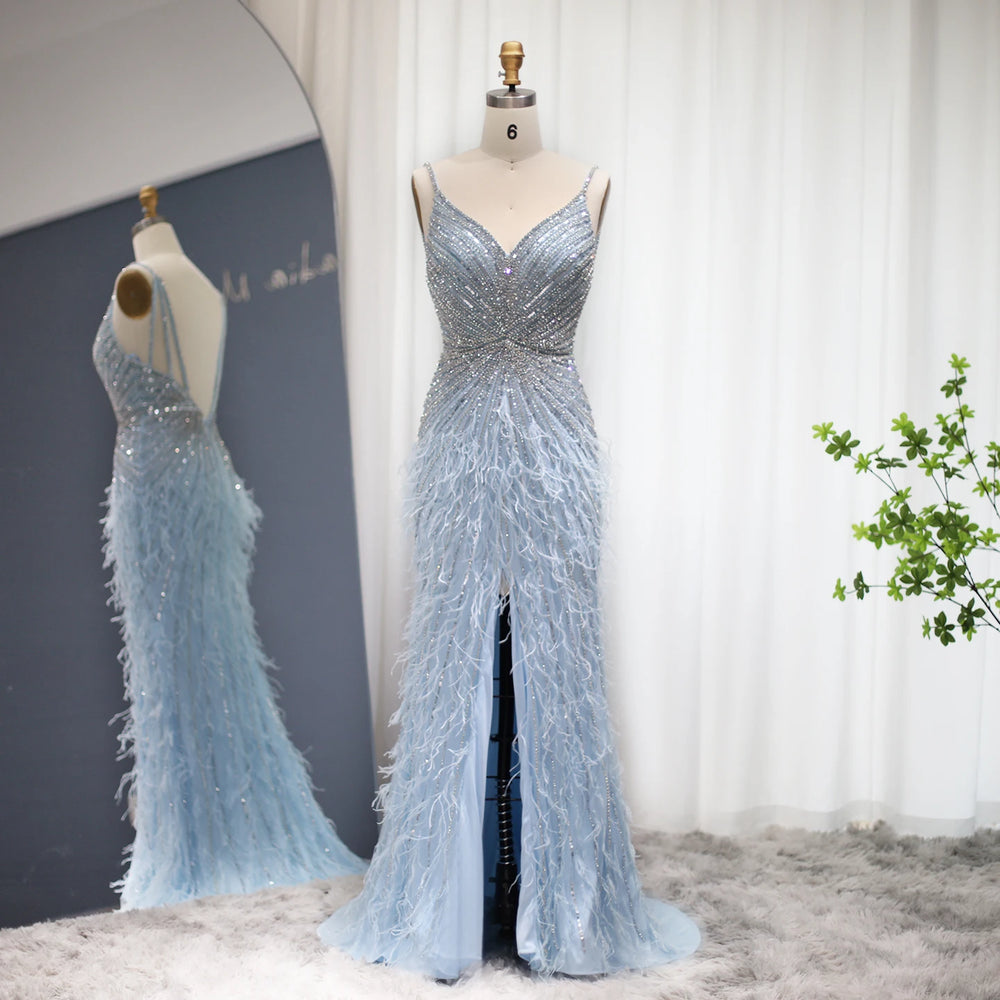 Blue evening gown with feather details on a mannequin against a neutral background