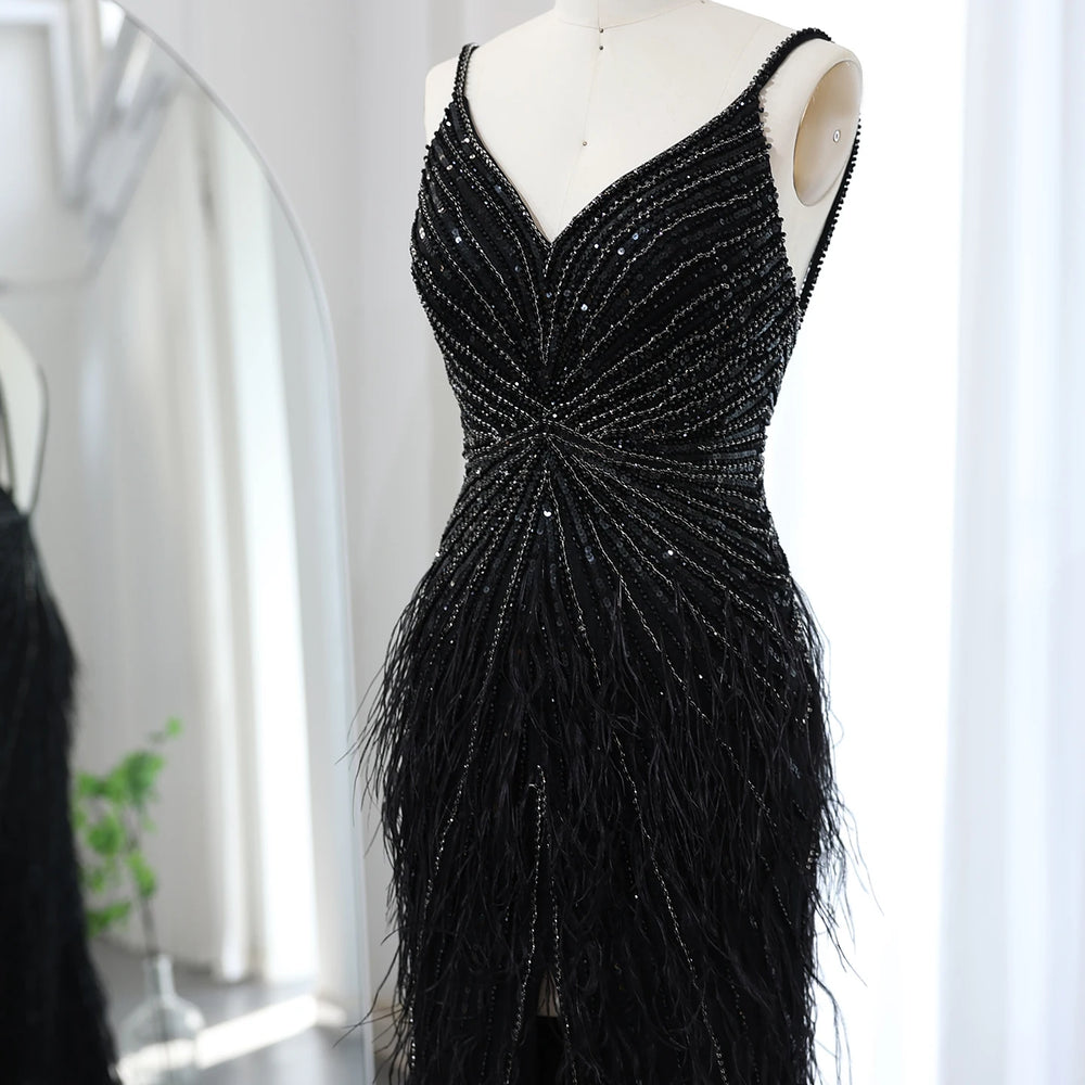 Black beaded evening gown on a mannequin against a white background