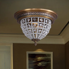 Decorative ceiling light fixture with crystal details in a room setting.