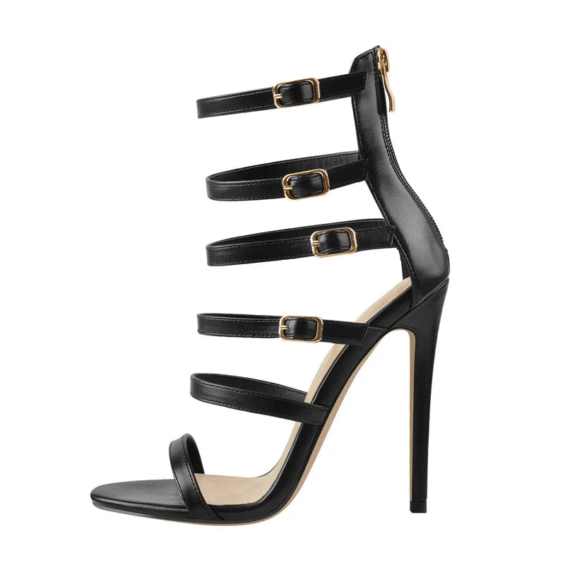 Detail of black thin high heel ankle strap sandals with buckle