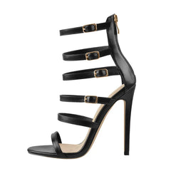 Detail of black thin high heel ankle strap sandals with buckle