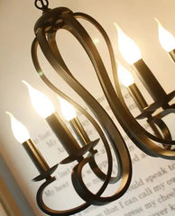 Modern 6-light candle iron semi-flush chandelier.