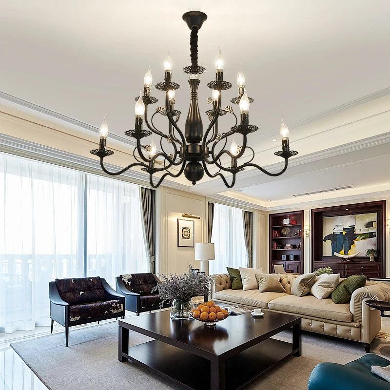 Black multi-arm candle-style chandelier flush-mounted in a modern, elegant living room