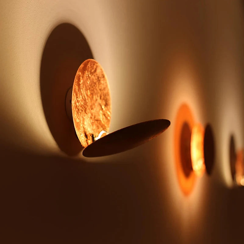 Close-up of a wall-mounted light fixture with a warm glow.