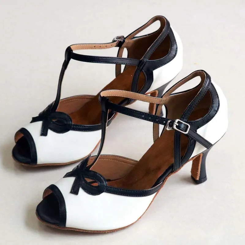 Pair of white and black T-strap dance heels