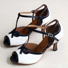 Pair of white and black T-strap dance heels