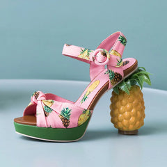 Close-up of the pineapple buckle detail and platform sole on the sandals. Golden Atelier 4