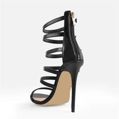 Side view of black thin high heel ankle strap sandals