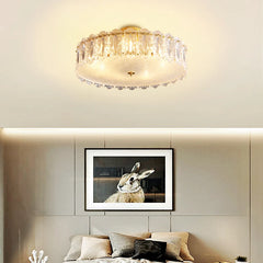 Ceiling light fixture above a wall with a framed picture of a rabbit.