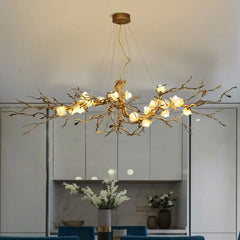 Branch-like chandelier with lights in a modern kitchen setting