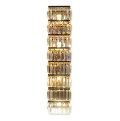 Decorative wall light fixture with crystal-like design on a white background