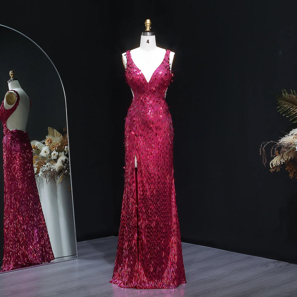 Red sequin evening gown on a mannequin against a dark background