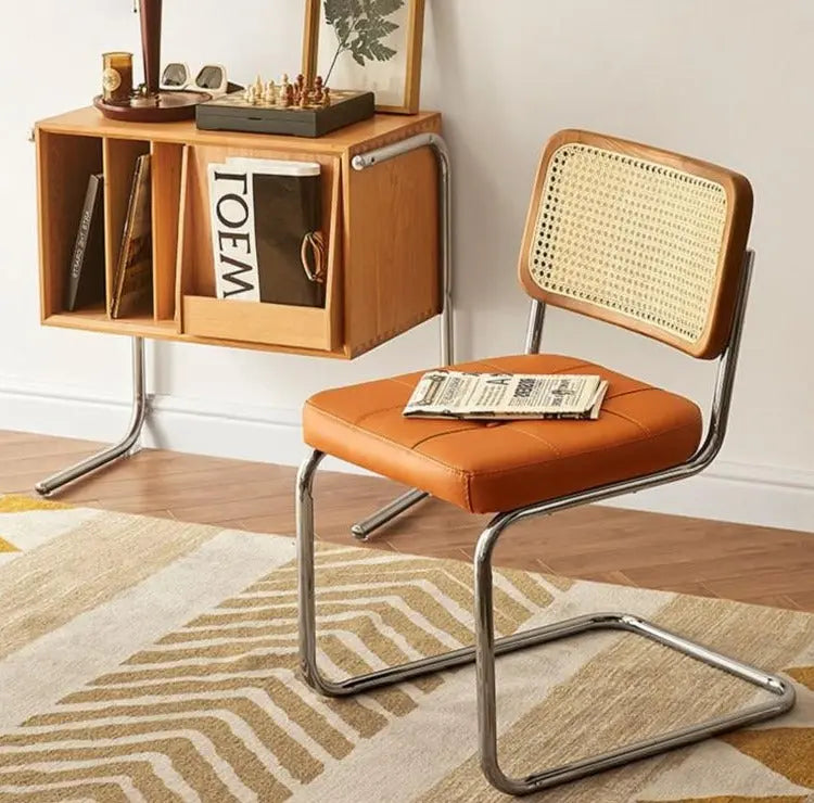 Golden Atelier living room chairs made from solid wood with a modern rattan design and comfortable armrests. Orange