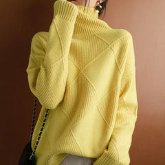 A female model wearing a yellow  knitted turtleneck pullover with a V-neck and long sleeves.