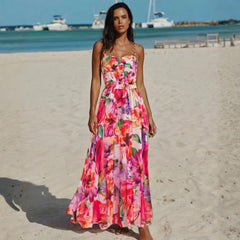 Floral print one-piece swimsuit and maxi skirt beachwear set on a model