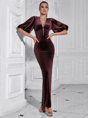 Women's maxi dress with puff sleeves and an open back.