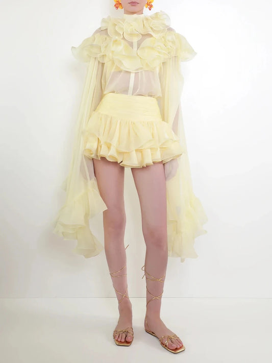 Full body view of pastel ruffle trim two-piece set with lace-up sandals