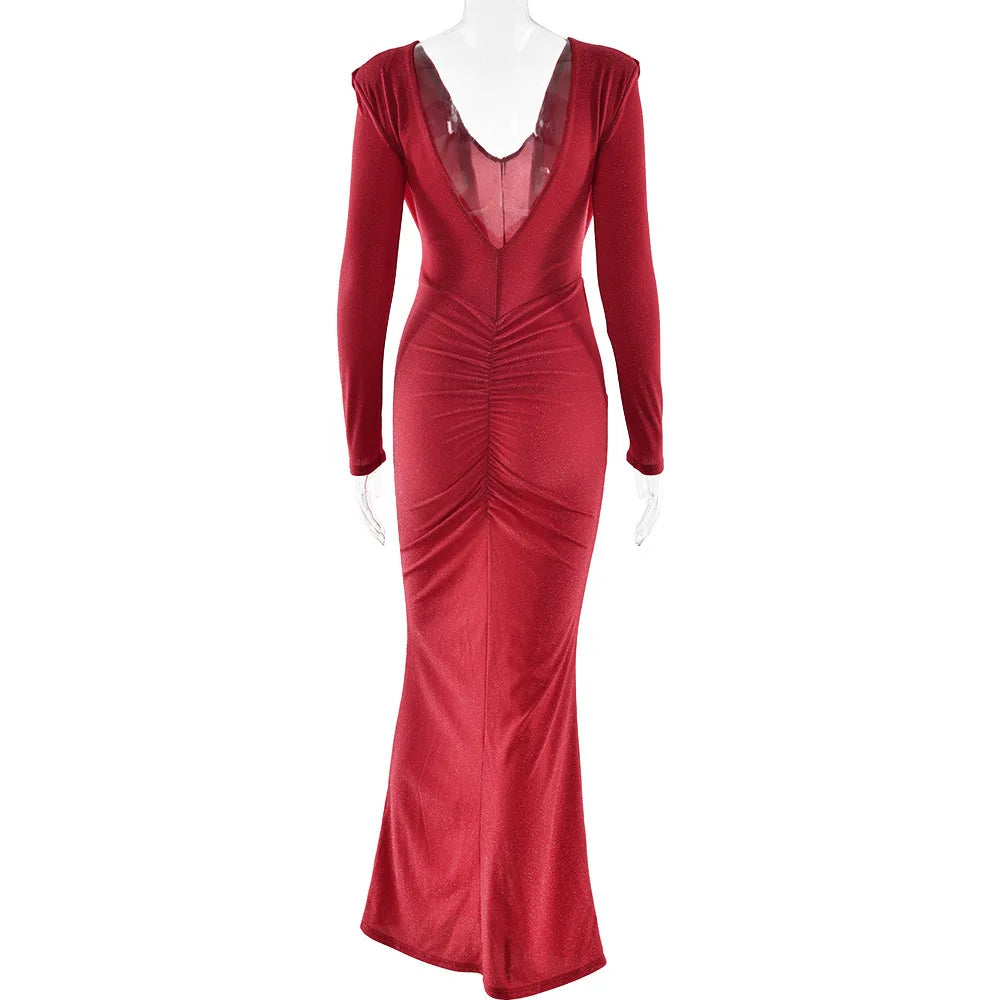 Red evening gown on a mannequin against a white background
