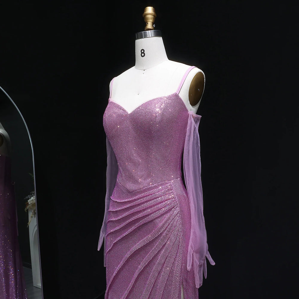 Purple sequin dress on a mannequin against a black background