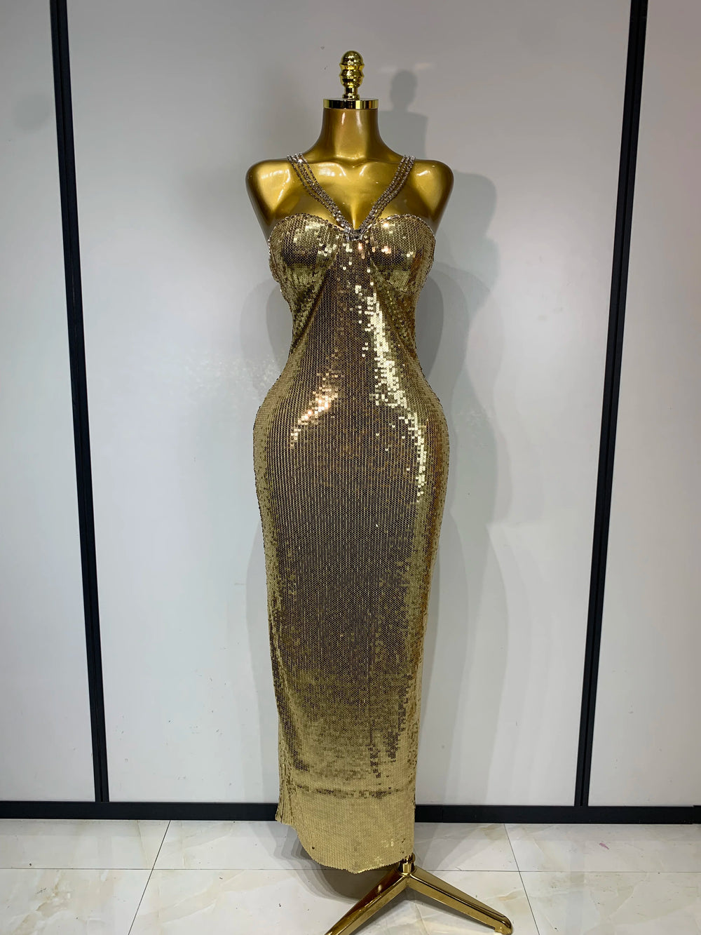 Gold glitter sequin column maxi dress with spaghetti straps.