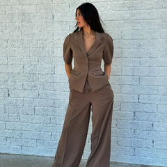 Women’s solid blazer pants set with wide-leg trousers and short-sleeve jacket.