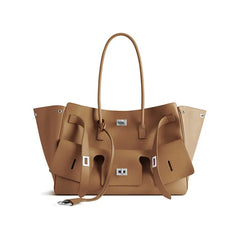 modern black tote with side straps and metallic accents