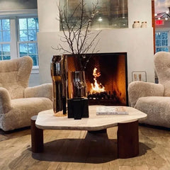 A vintage coffee table with an irregular shape, placed in a cozy living room setting.  Golden Atelier 3