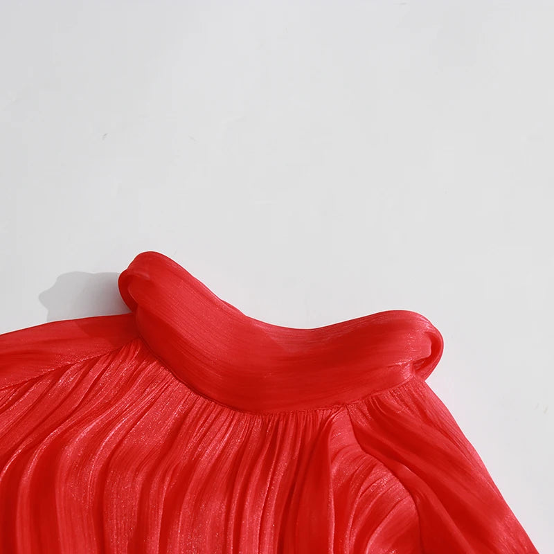 Close-up of a red garment with a white background