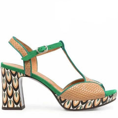  Close-up of textured leather platform sandals with square toe and thick heel. 3