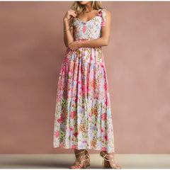 Person wearing a floral smocked bust tie strap maxi dress.