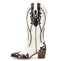 White cowboy boot with black intricate designs on a white background