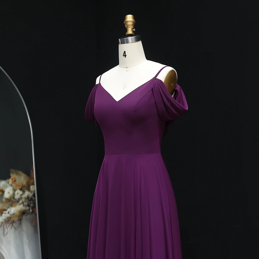 Purple dress on a mannequin against a black background