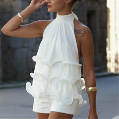 White halter neck ruffle crop top on a woman.
