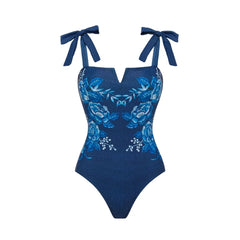 Close-up of the blue floral patterned one-piece swimsuit from the two-piece set.
