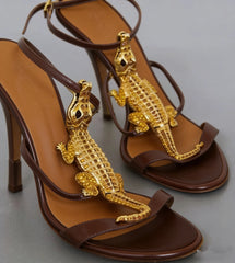 Brown leather high heel sandals with gold alligator embellishments