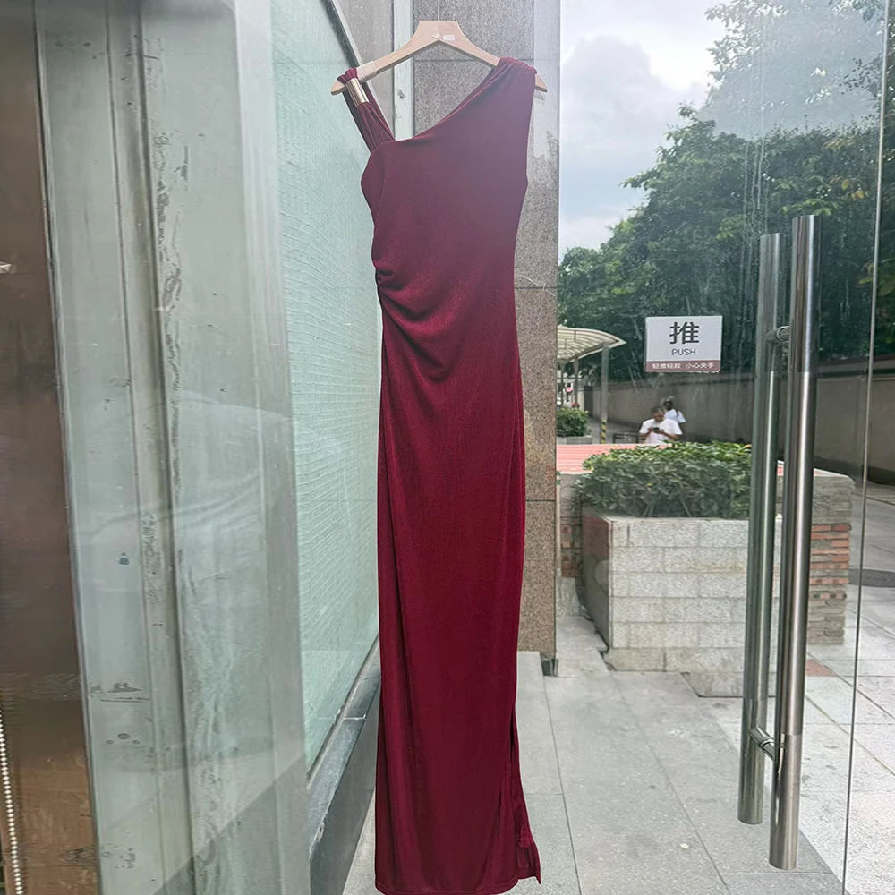 Red one-shoulder ruched maxi dress displayed in storefront