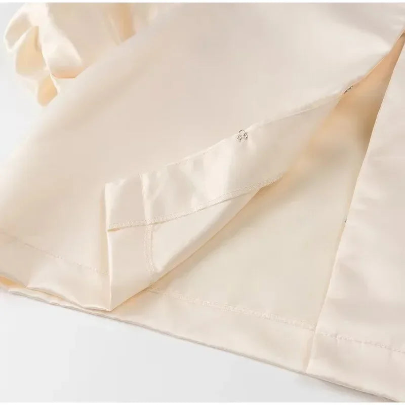 Close-up of beige fabric with a pocket on a white background