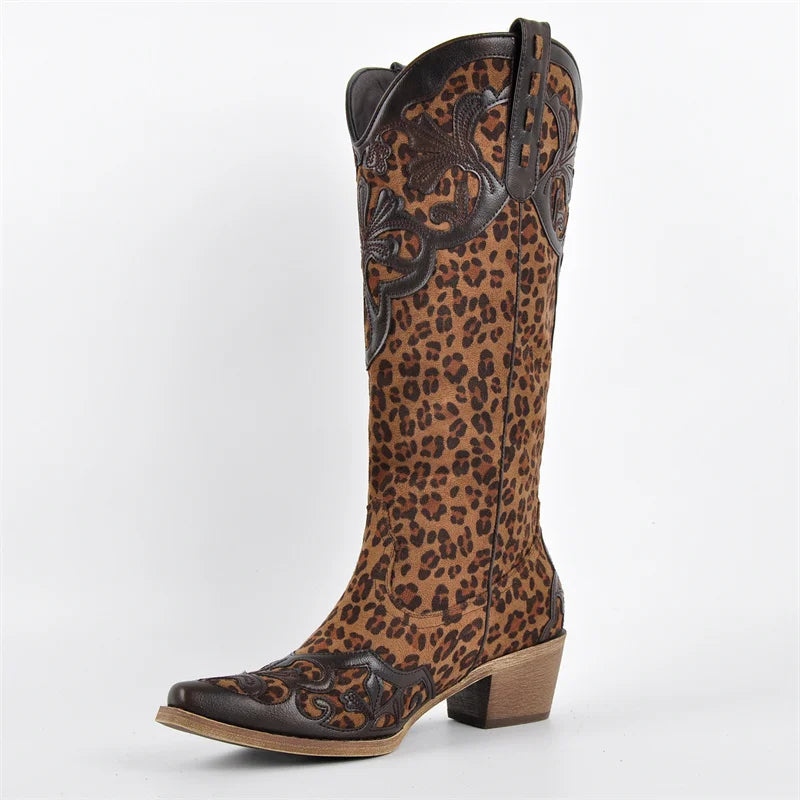 Side view of leopard print knee-high boots with decorative overlays and a chunky heel