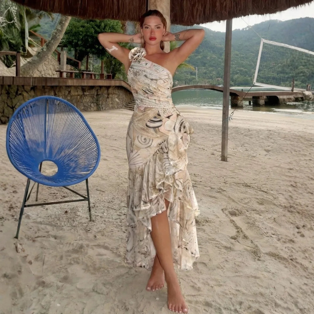 One-shoulder swimsuit and ruffled skirt set with abstract print