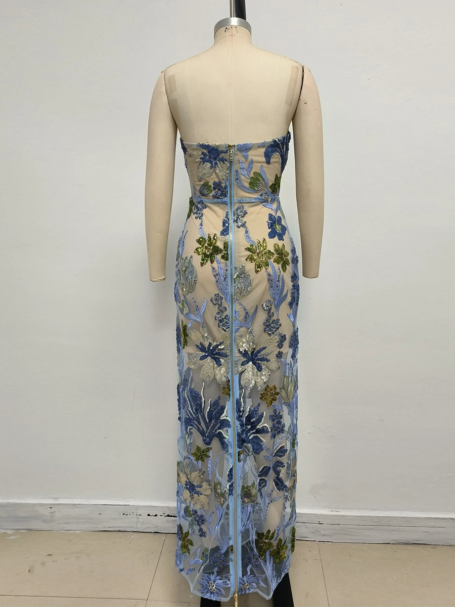 Floral dress on a mannequin against a plain background