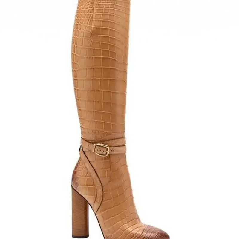 Patchwork snake print knee-high dress boots with a buckle strap and chunky square heel.