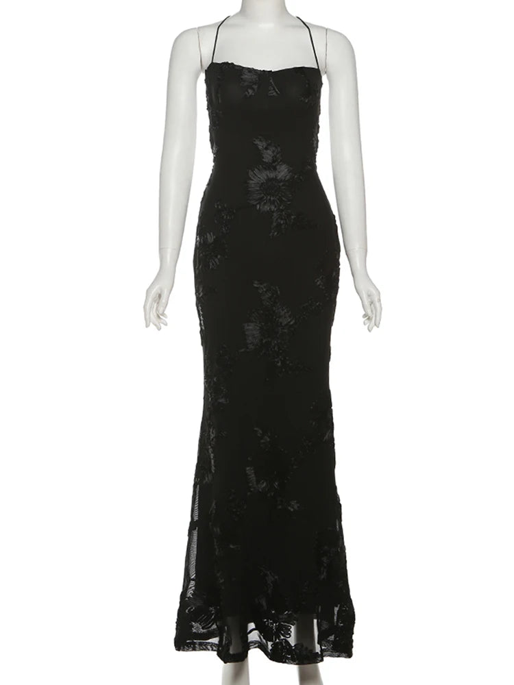 Black sequin dress on a mannequin against a white background