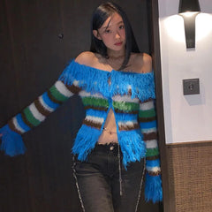 Model wearing the striped fringed knit cardigan indoors