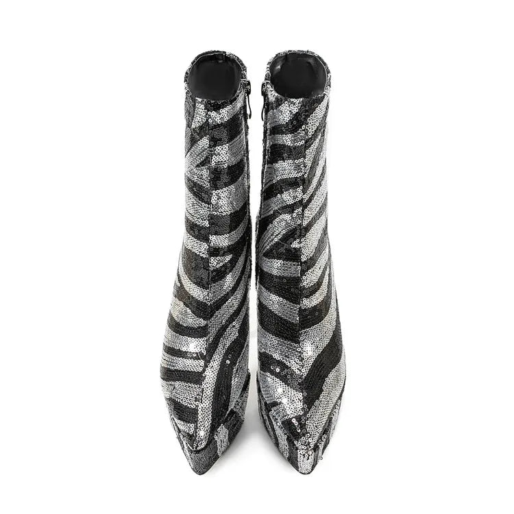 Pair of zebra-striped ankle boots on a white background